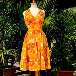 Vintage halter sundress with yellow and orange flowers.